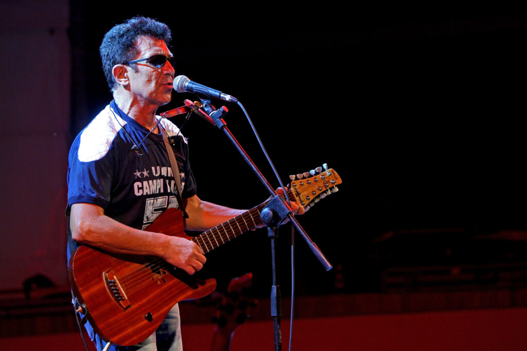 XVI Mediterranean Games - Edoardo Bennato Performs At Casa Italia