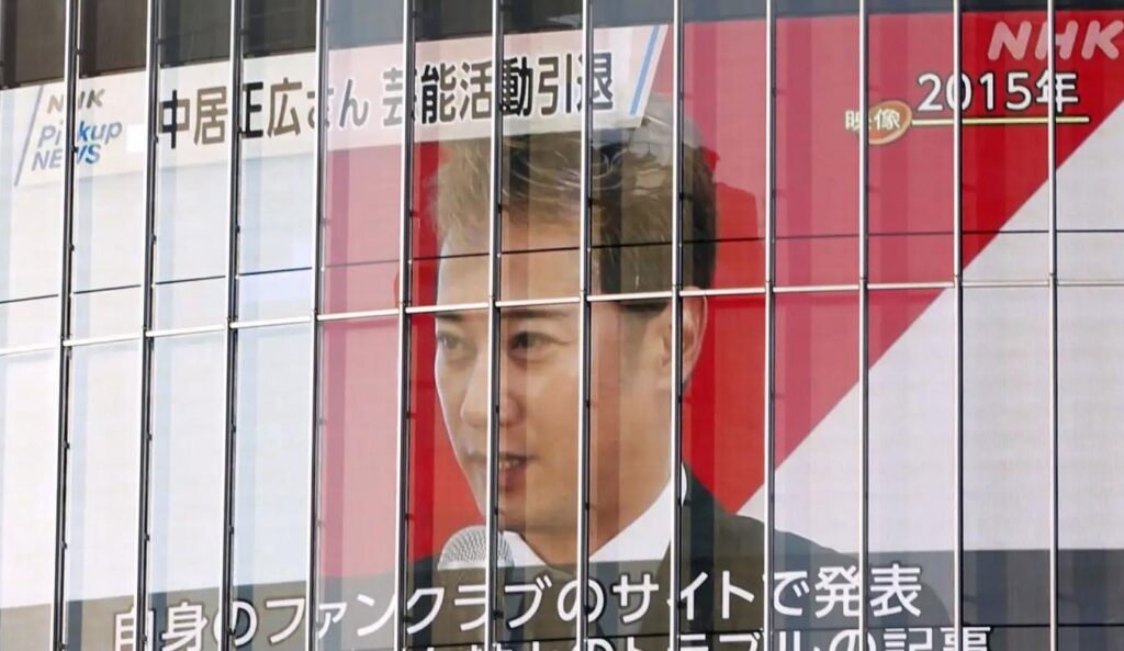 A monitor on a building in Tokyo's Shibuya area shows the news on Jan. 23, 2025, that Masahiro Nakai, a popular TV