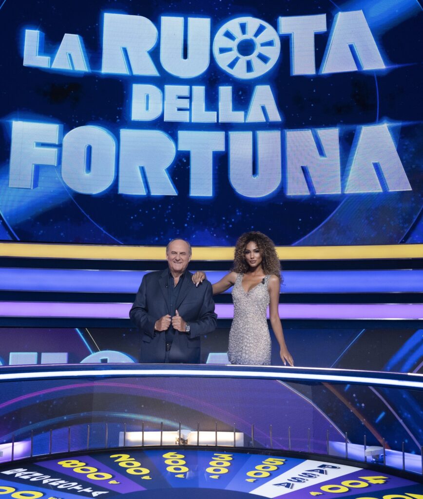 GERRY SCOTTI E SAMIRA LUI LOGO - Copia