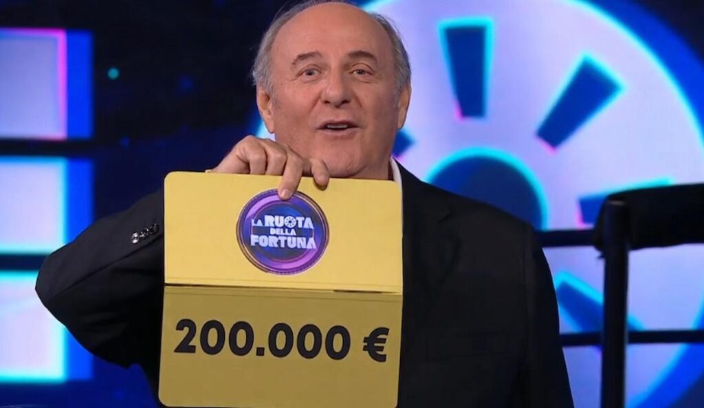 scotti consegna 200mila euro ruota della fortuna